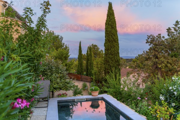 Idyllic scenery including a small swimming pool seen in Beaumes-de-Venise, a commune in the