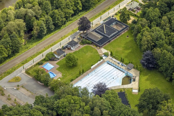 Aerial view, outdoor swimming pool Neheim, swimming pool without water, in the forest area at the