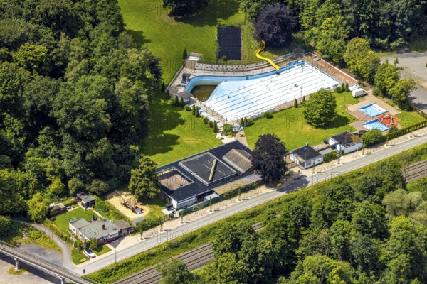 Aerial view, outdoor swimming pool Neheim, swimming pool without water, in the forest area at the