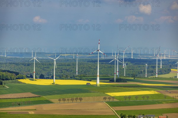 Aerial view, wind park and wind farm wind energy plant, wind turbines and rape fields near