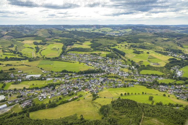 Aerial view, local view residential area Banfe, wooded hilly landscape, distant view and blue sky