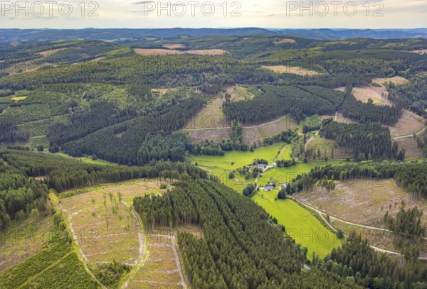 Aerial view, Homrighausen forester's lodge, half-timbered house in picturesque hilly landscape with