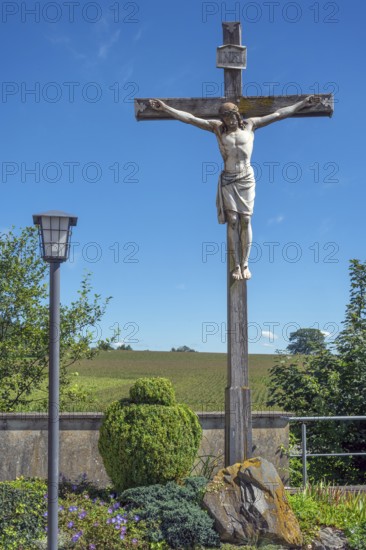 Crucifix and lantern at the Roman Catholic parish church of the Assumption of the Virgin Mary in
