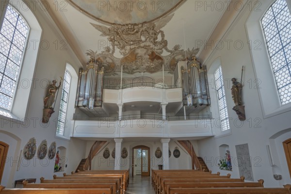 Interior of the Roman Catholic parish church of the Assumption of the Virgin Mary with organ loft
