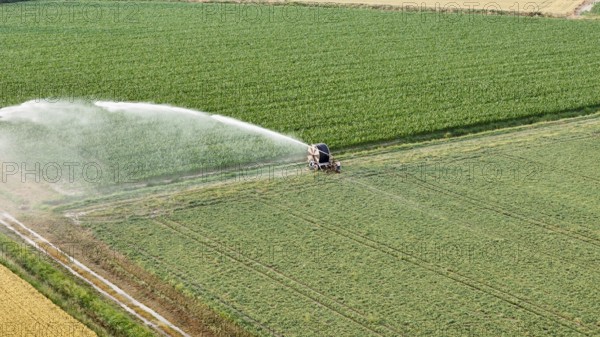 Modern agricultural technology ensures essential water supply for soybean crops during springtime