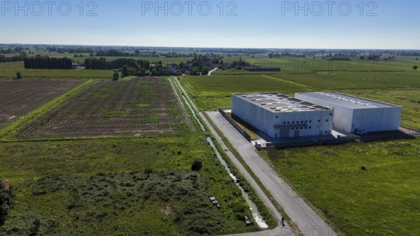 Modern data center facility situated in a rural landscape of Lombardy Italy surrounded by