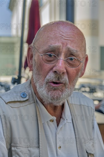 Elderly gentleman with beard and glasses, doubtful look, Dornbirn, Vorarlberg, Austria