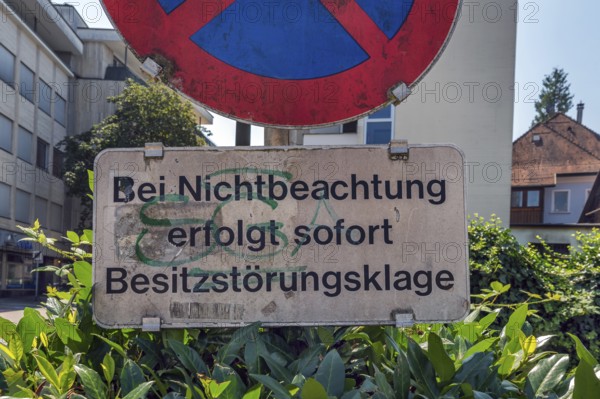 No stopping sign with the notice In the event of non-compliance, immediate action for possession