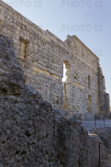 08/21/2025 Ronda, Malaga, Spain Main facade of the ruins of the Roman amphitheater of Acinipo with