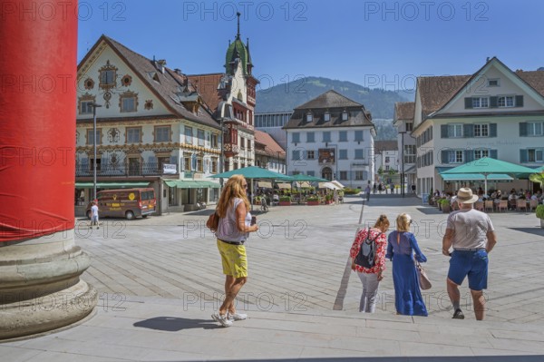 The Steinhauser or Johann Luger House and the town museum with tourists on the market square,