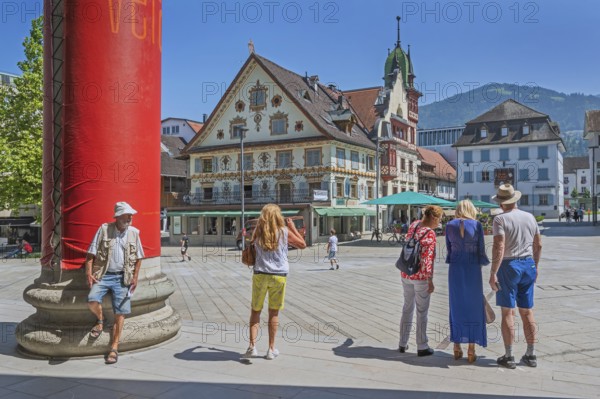 The Steinhauser or Johann Luger House and the town museum with tourists on the market square,