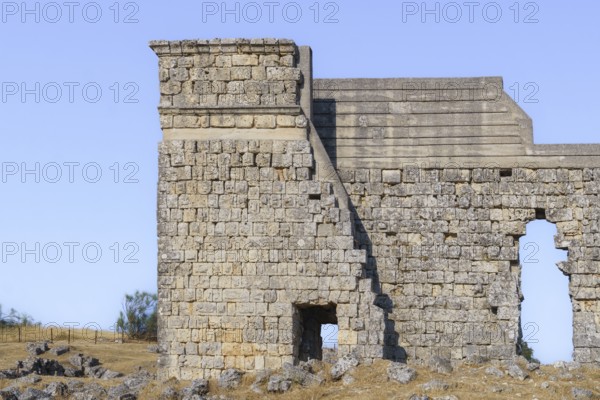 08/21/2025 Ronda, Malaga, Spain Main facade of the ruins of the Roman amphitheater of Acinipo with
