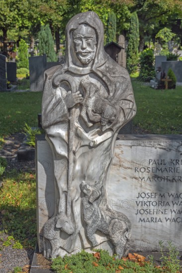 Gravesite with stone figure, the good shepherd with lambs, catholic cemetery, Kempten, Allgäu,