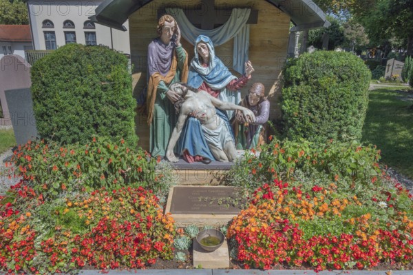 Gravesite with depiction of the Descent from the Cross and floral decoration, Catholic cemetery,