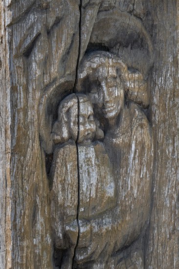 Wooden grave column with carving, mother and child, catholic cemetery, Kempten, Allgäu, Bavaria,