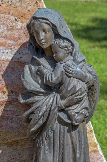 Gravesite with bronze figure, mother with child, catholic cemetery, Kempten, Allgäu, Bavaria,