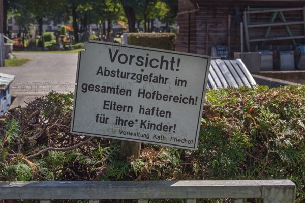 Warning sign, danger of falling, parents are liable for their children, catholic cemetery, Kempten,