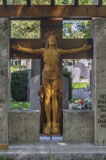 Gravesite with crucifix, catholic cemetery, Kempten, Allgäu, Bavaria, Germany