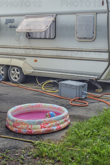Lord Ambassador caravan with electricity and water connections and children's paddling pool at