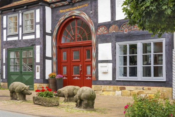 Reminder of former pig market in front of historic half-timbered house Brennerstrasse Rinteln