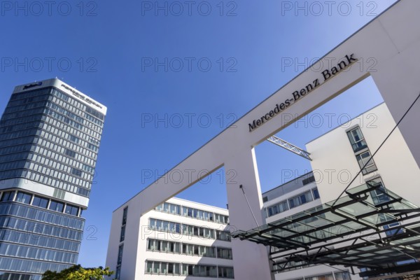 Mercedes Benz Bank Stuttgart. Exterior view with logo. On the left the Porsche Design Tower.