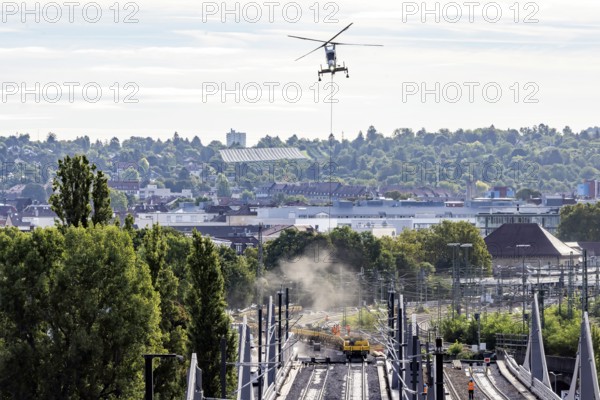 Track construction from the air. At Bad Cannstatt railway station, a transport helicopter