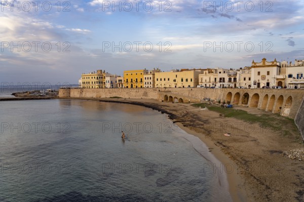The Spiaggia della Purità city beach and the historic centre of Gallipoli, Apulia, Italy