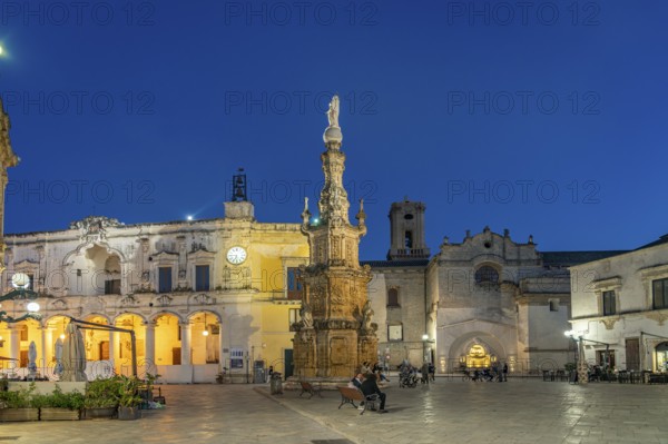 Piazza Salandra with the Guglia dell'Immacolata column and Palazzo di città at dusk, Nardo, Apulia,