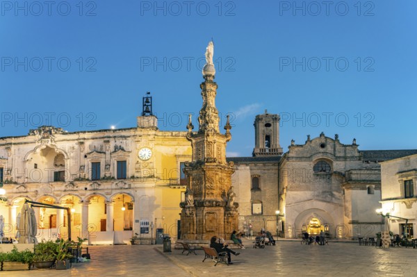 Piazza Salandra with the Guglia dell'Immacolata column and Palazzo di città at dusk, Nardo, Apulia,