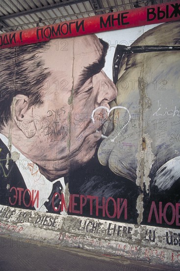 Artwork shows Leonid Brezhnev and Erich Honecker kissing, painting was created in 1990 at the
