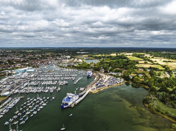 Wight Light car ferry to Isle of Wight on Lymington River and marina from drone, Lymington, New