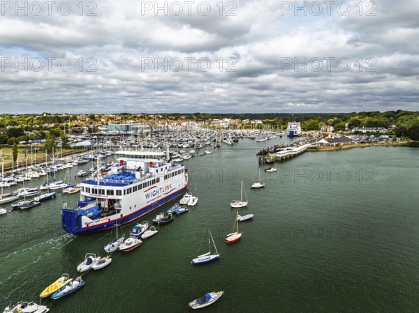 Wight Light car ferry to Isle of Wight on Lymington River and marina from drone, Lymington, New