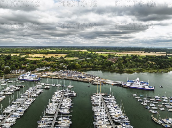 Wight Light car ferry to Isle of Wight on Lymington River and marina from drone, Lymington, New