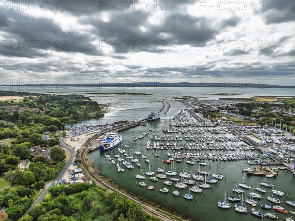 Wight Light car ferry to Isle of Wight on Lymington River and marina from drone, Lymington, New
