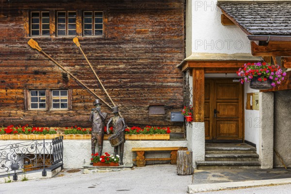 Copper sculptures of drummers and pipers, Saint Luc town house, Val d'Anniviers, Valais Alps,