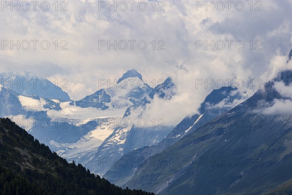 Four-thousand metre mountains and glaciers in clouds, above Zinal, Val d'Anniviers, Valais Alps,