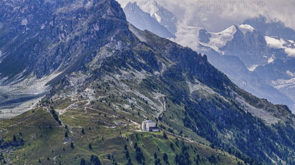The historic Hotel Weisshorn below the Weisshorn mountain, behind the four-thousand-metre peaks and