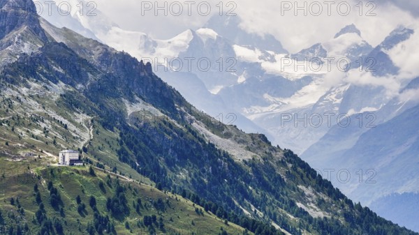 The historic Hotel Weisshorn below the Weisshorn mountain, behind the four-thousand-metre peaks and