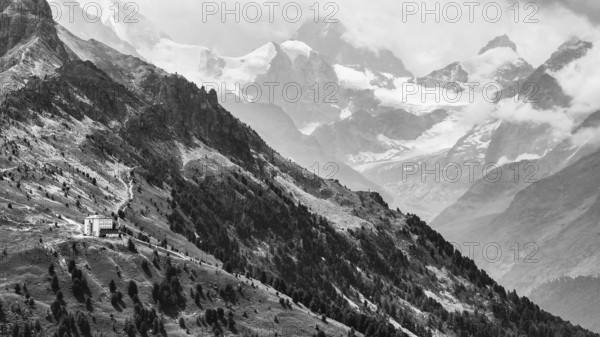 The historic Hotel Weisshorn below the Weisshorn mountain, behind the four-thousand-metre peaks and