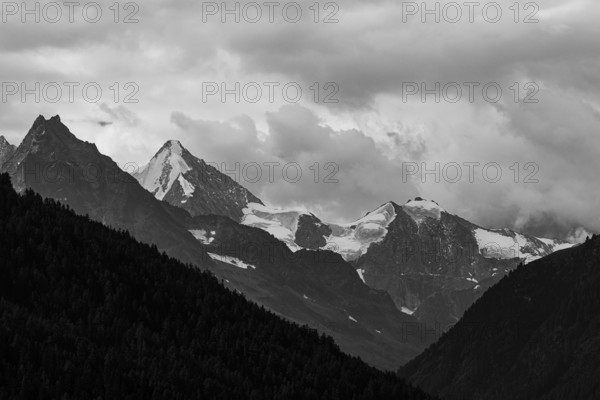 The Besso mountains with twin peaks and the Obergabelhorn, black and white photograph, view from