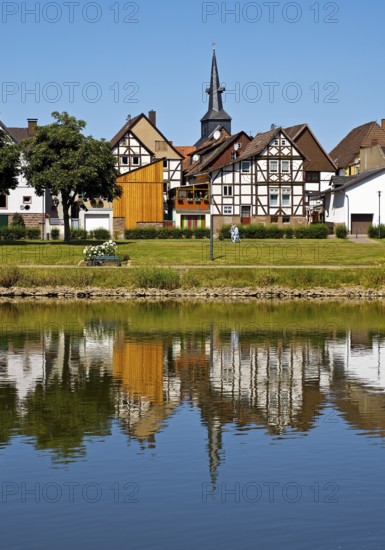 View over the river Weser to the old town centre of Bodenwerder with the church tower of St.
