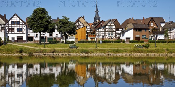 View over the river Weser to the old town centre of Bodenwerder with the church tower of St.