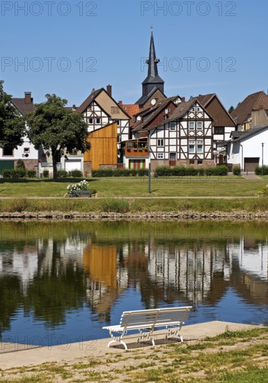 View over the river Weser to the old town centre of Bodenwerder with the church tower of St.