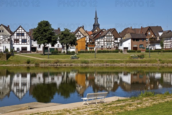 View over the river Weser to the old town centre of Bodenwerder with the church tower of St.