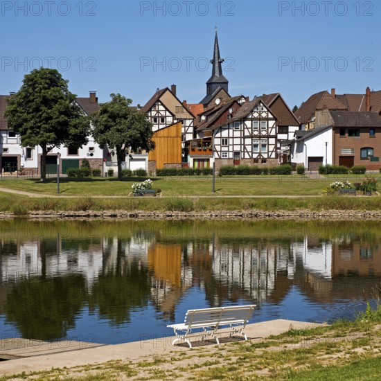 View over the river Weser to the old town centre of Bodenwerder with the church tower of St.