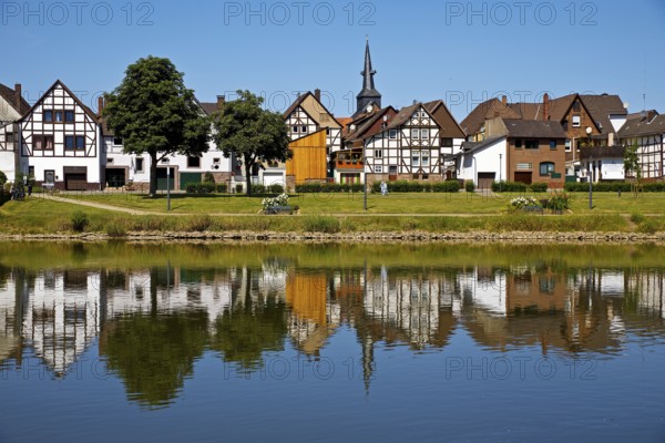 View over the river Weser to the old town centre of Bodenwerder with the church tower of St.