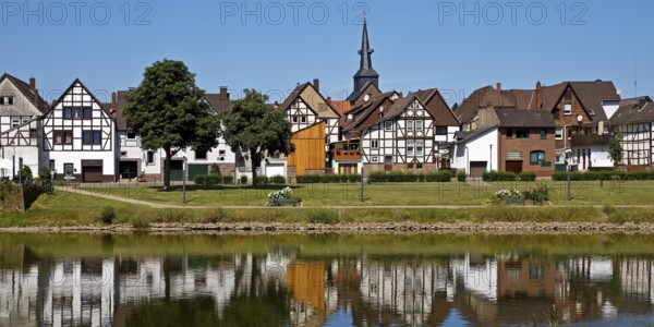 View over the river Weser to the old town centre of Bodenwerder with the church tower of St.