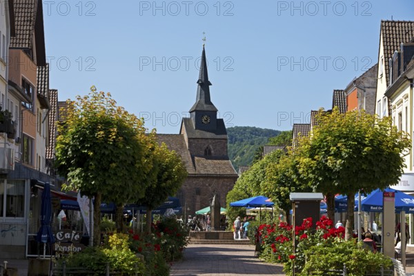 Pedestrian zone to the Protestant town church of St Nicolai in the Münchhausen town of Bodenwerder,