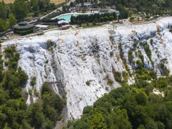 White limestone formation with lush vegetation, geological structure, aerial view, Akkaya