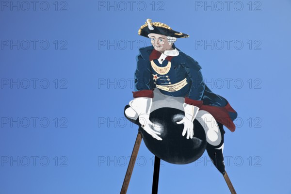 The ride on Münchhausen's cannonball, depicted in the Münchhausen town of Bodenwerder,
